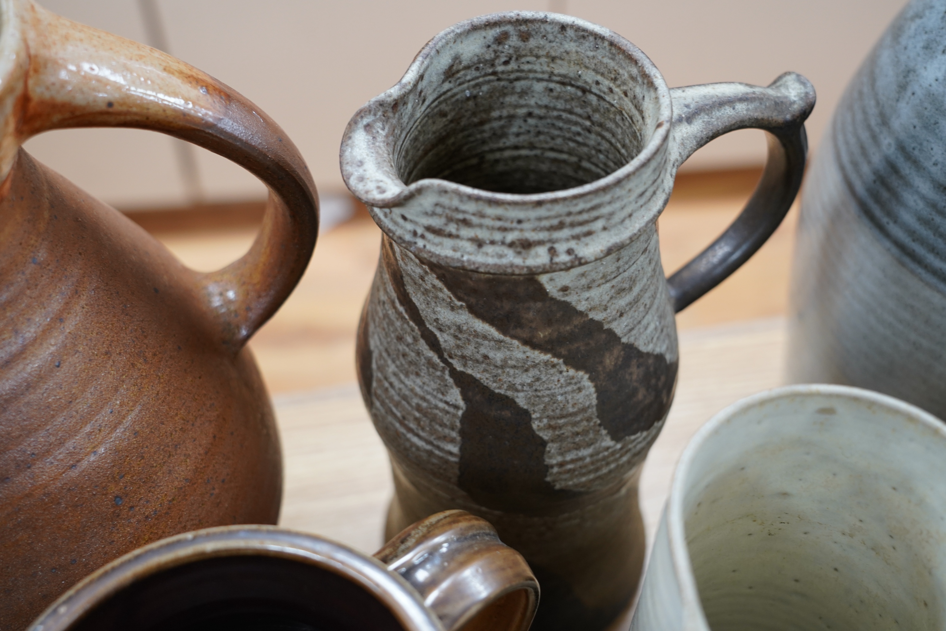 Nine studio pottery jugs, a vase and a bowl, etc. (11)